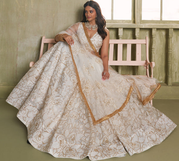 Magnetic Cream Color Net Fabric Party Wear Lehenga