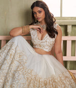 Magnetic Cream Color Net Fabric Party Wear Lehenga