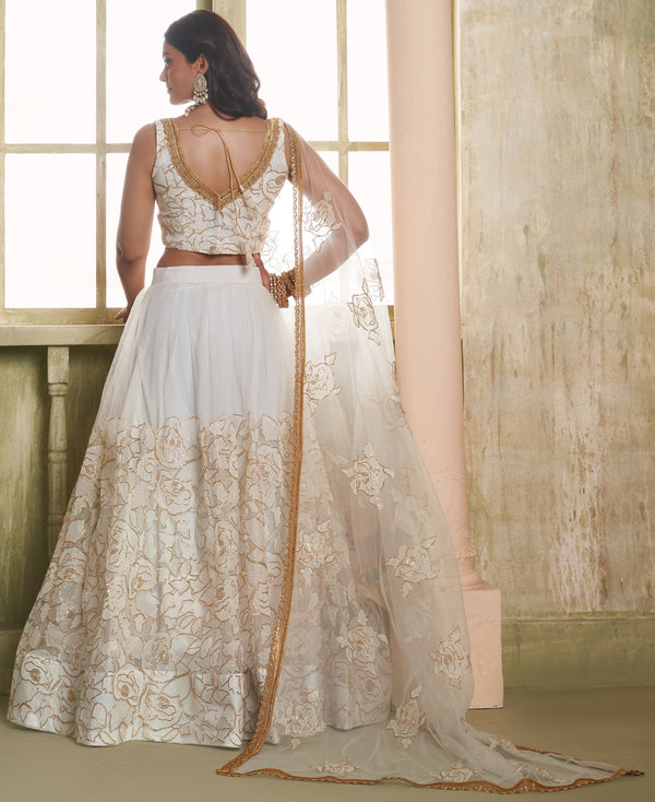 Magnetic Cream Color Net Fabric Party Wear Lehenga