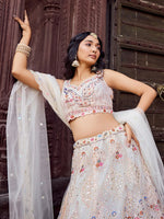 Charming Cream Color Net Fabric Party Wear Lehenga