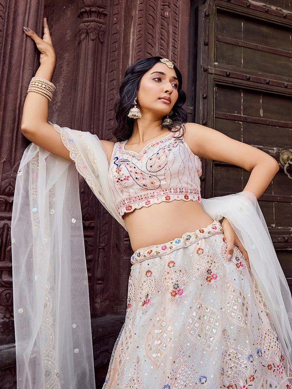 Charming Cream Color Net Fabric Party Wear Lehenga