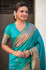 Beauteous Teal Color Silk Fabric Partywear Saree