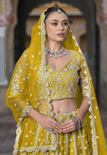 Dazzling Yellow Color Net Fabric Party Wear Lehenga