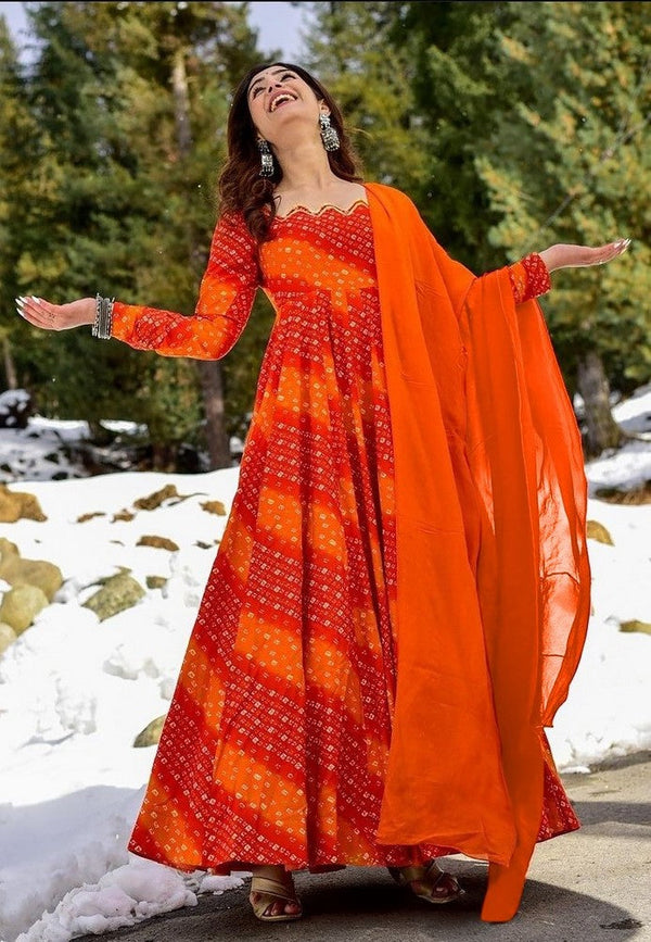 Striking Orange Color Rayon Fabric Gown with Dupatta