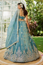 Dazzling Turquoise Color Organza Fabric Party Wear Lehenga