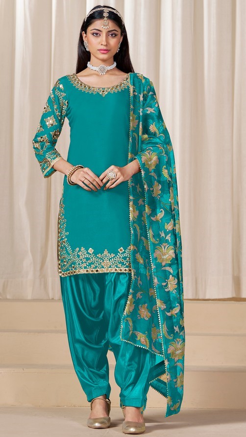 Tasteful Turquoise Color Silk Fabric Patiala Suit