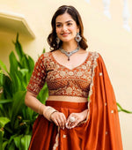 Angelic Orange Color Silk Fabric Party Wear Lehenga