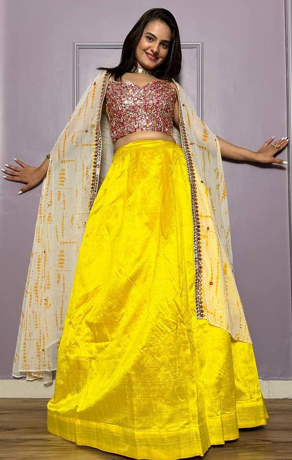 Striking Yellow Color Silk Fabric Party Wear Lehenga