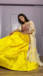Striking Yellow Color Silk Fabric Party Wear Lehenga