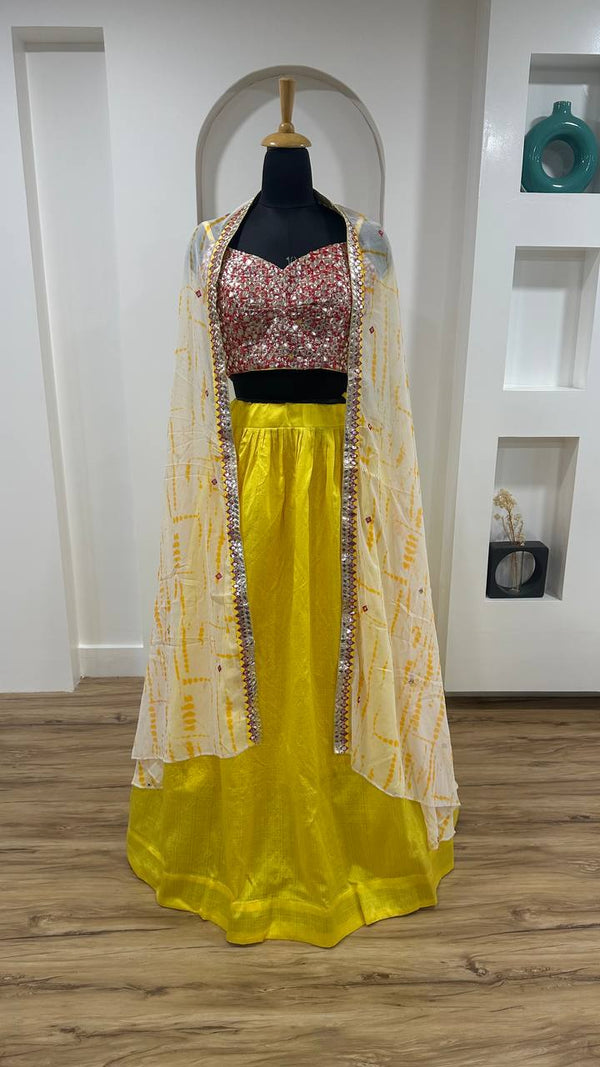 Striking Yellow Color Silk Fabric Party Wear Lehenga