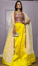 Striking Yellow Color Silk Fabric Party Wear Lehenga