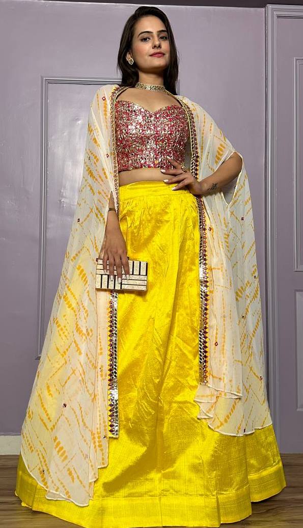 Striking Yellow Color Silk Fabric Party Wear Lehenga