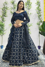 Dazzling Teal Color Jimmy Fabric Party Wear Lehenga