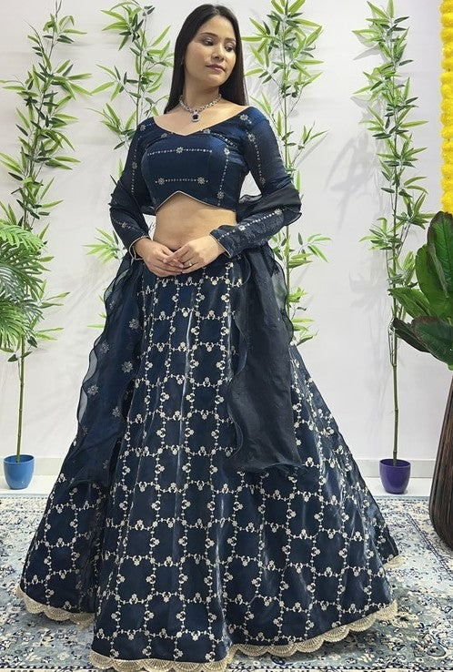 Dazzling Teal Color Jimmy Fabric Party Wear Lehenga