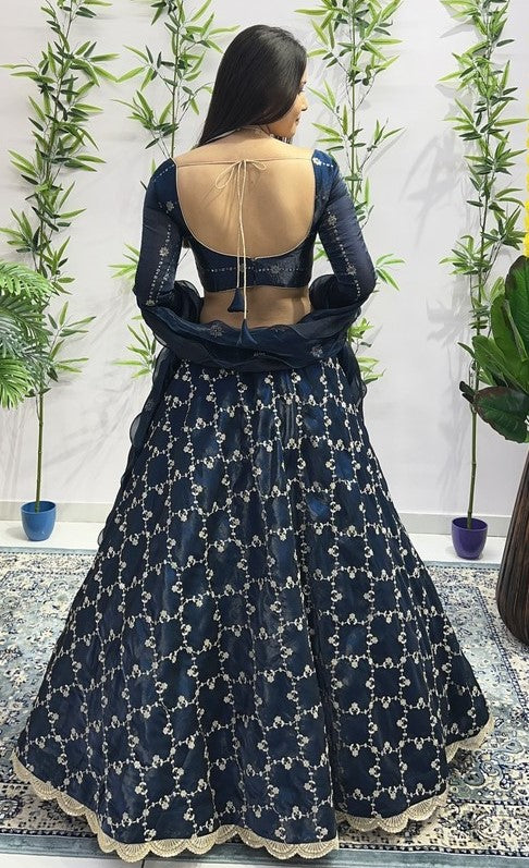 Dazzling Teal Color Jimmy Fabric Party Wear Lehenga