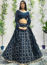 Dazzling Teal Color Jimmy Fabric Party Wear Lehenga