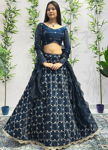 Dazzling Teal Color Jimmy Fabric Party Wear Lehenga