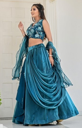 Dazzling Teal Color Jimmy Fabric Party Wear Lehenga