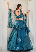 Dazzling Teal Color Jimmy Fabric Party Wear Lehenga