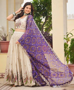 Impressive Cream Color Tissue Fabric Party Wear Lehenga