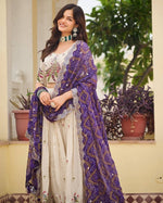 Impressive Cream Color Tissue Fabric Party Wear Lehenga