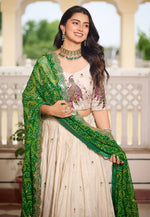 Impressive Cream Color Tissue Fabric Party Wear Lehenga
