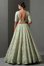 Magnetic Green Color Silk Fabric Party Wear Lehenga