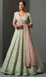 Magnetic Green Color Silk Fabric Party Wear Lehenga