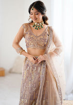 Angelic Peach Color Net Fabric Party Wear Lehenga