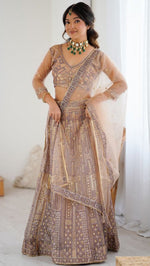 Angelic Peach Color Net Fabric Party Wear Lehenga