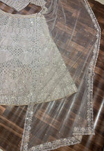 Desirable Cream Color Net Fabric Wedding Lehenga