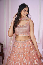 Charming Peach Color Net Fabric Party Wear Lehenga