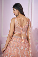Charming Peach Color Net Fabric Party Wear Lehenga