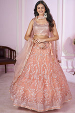 Charming Peach Color Net Fabric Party Wear Lehenga