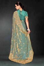 Lovely Turquoise Color Silk Fabric Partywear Saree