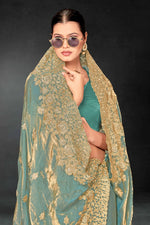 Lovely Turquoise Color Silk Fabric Partywear Saree