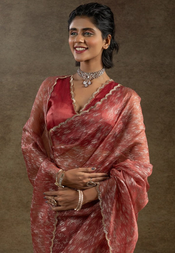 Beauteous Peach Color Tissue Fabric Partywear Saree