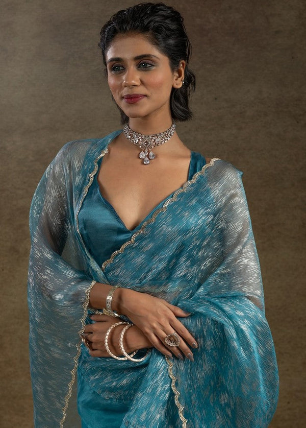 Beauteous Turquoise Color Tissue Fabric Partywear Saree