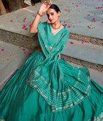 Glowing Turquoise Color Chanderi Fabric Party Wear Lehenga