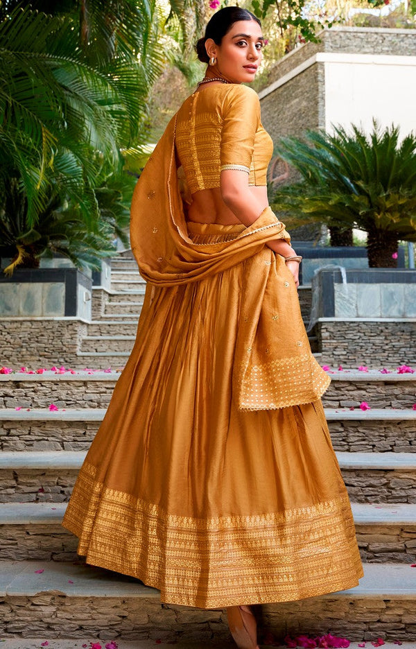 Glowing Mustard Color Chanderi Fabric Party Wear Lehenga