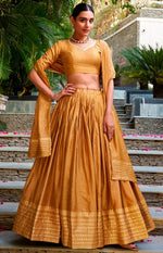 Glowing Mustard Color Chanderi Fabric Party Wear Lehenga