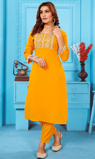 Lovely Mustard Color Rayon Fabric Kurti With Bottom