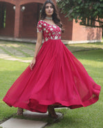 Tempting Magenta Color Blooming Fabric Gown