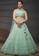 Magnetic Turquoise Color Net Fabric Party Wear Lehenga