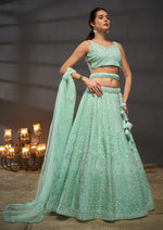 Magnetic Turquoise Color Net Fabric Party Wear Lehenga