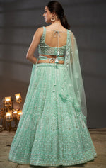 Magnetic Turquoise Color Net Fabric Party Wear Lehenga