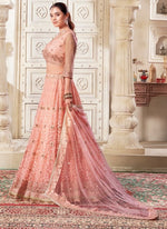 Magnetic Peach Color Net Fabric Party Wear Lehenga