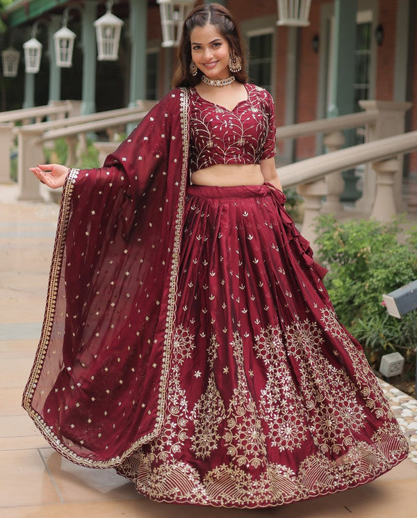 Magnetic Maroon Color Rangoli Fabric Party Wear Lehenga