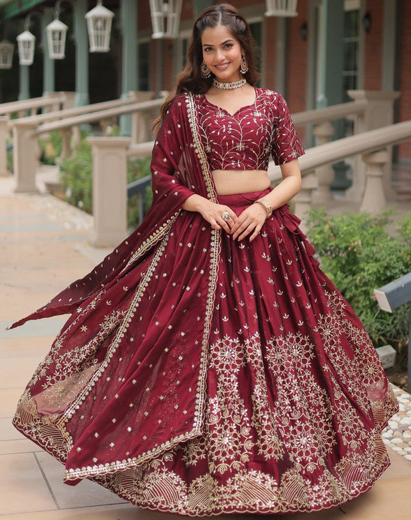 Magnetic Maroon Color Rangoli Fabric Party Wear Lehenga