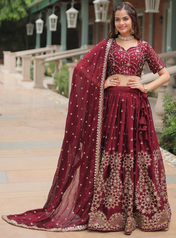 Magnetic Maroon Color Rangoli Fabric Party Wear Lehenga